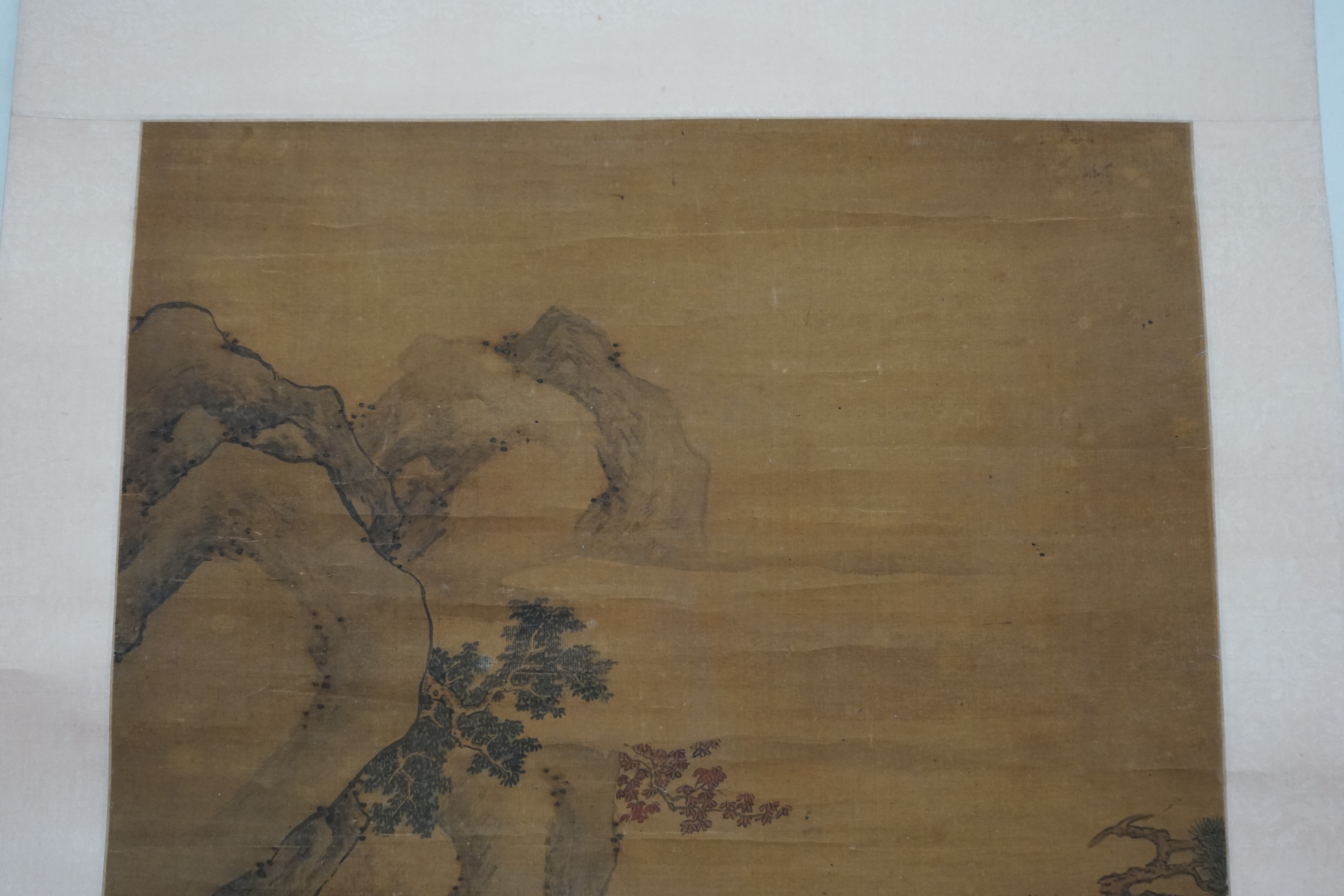 Chinese School, 18th century, a scroll painting on silk of figures on a boat, signed Qiu Ying